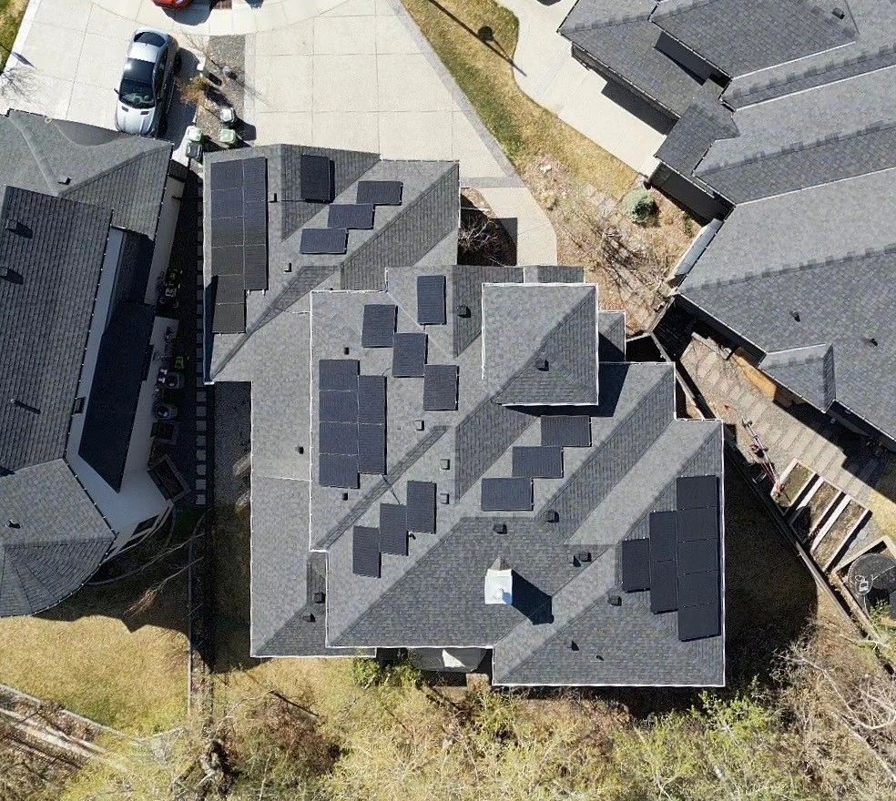 Residential solar panel installation on a complex roof by Calgary solar installers