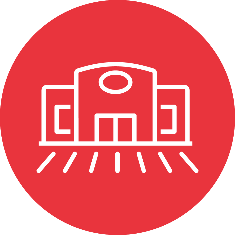 The image is a stylized, white line drawing of a building on a red circular background. It features geometric shapes, a central doorway, and lines indicating light.