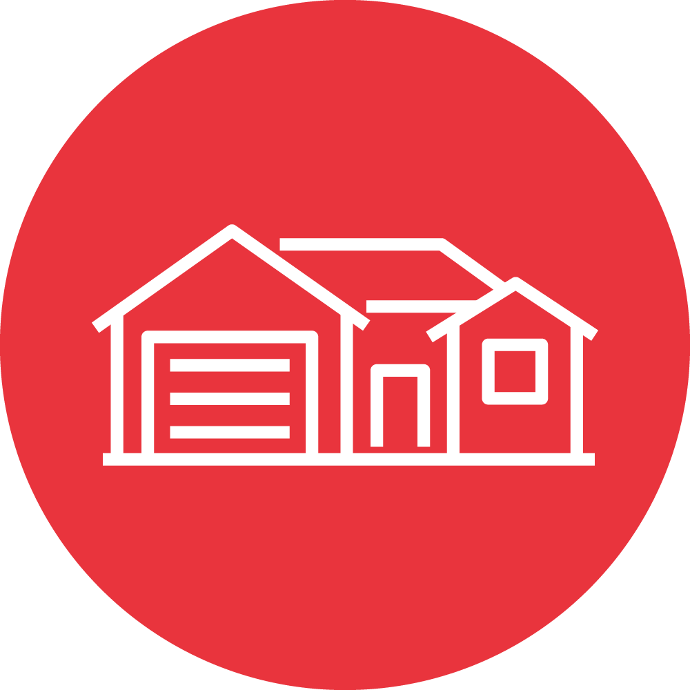 This is a simple white line drawing of a house and garage on a red circular background, possibly representing a real estate or housing icon.