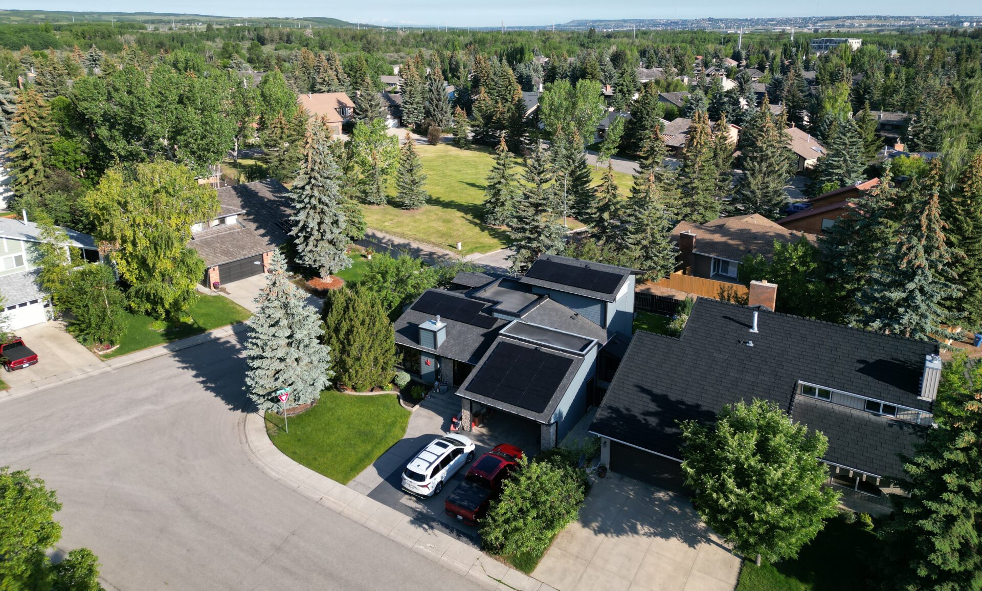 Aerial view of a residential neighborhood in Calgary where Rocky Mountain Solar Co provides solar panel installations.