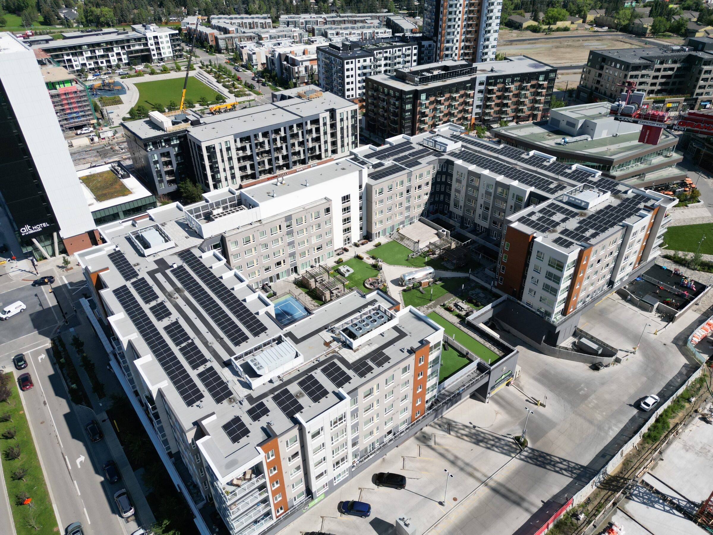 Commercial rooftop solar panel installation on ARIA building in Calgary, Alberta