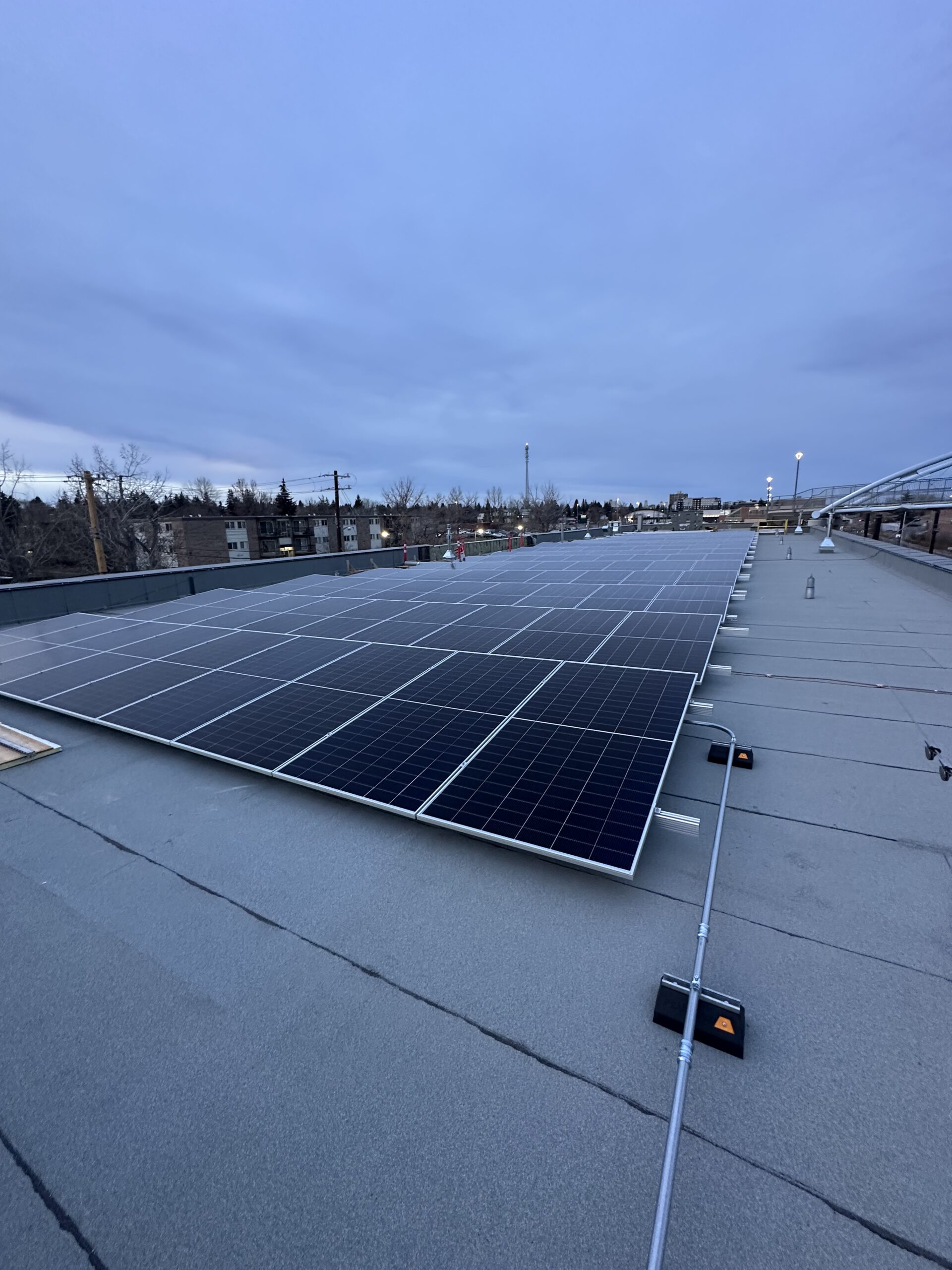 Commercial solar panel installation on a flat roof in SE Calgary by Rocky Mountain Solar Co.ain Solar Co.